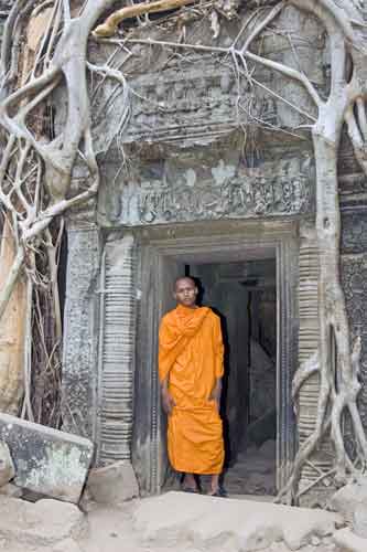 monk at ruin-AsiaPhotoStock