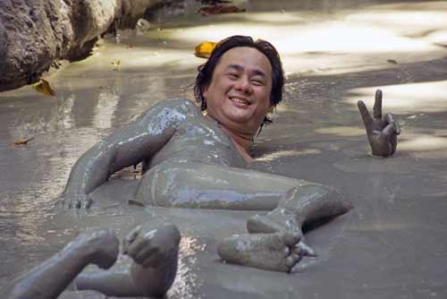 kim in volcsnic mud bath-AsiaPhotoStock