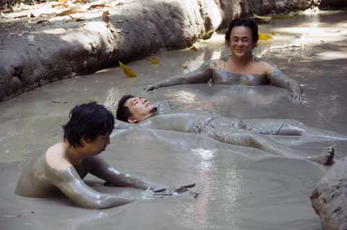 mud bath three guys-AsiaPhotoStock