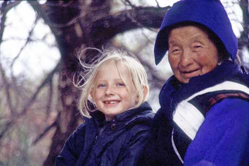 naxi and tourist-AsiaPhotoStock