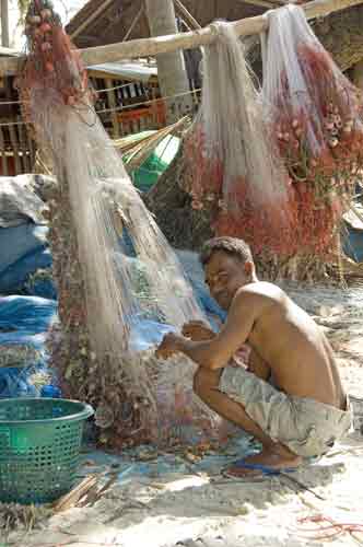 net mending on beach-AsiaPhotoStock