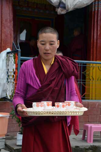 nun serving tea-AsiaPhotoStock