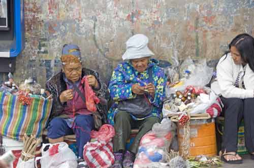 baguio ladies by wall-AsiaPhotoStock