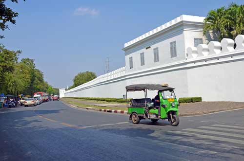 tuk tuk by palace wall-AsiaPhotoStock