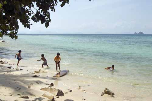 boys playing in sea-AsiaPhotoStock