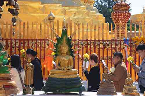 praying at doi suthep-AsiaPhotoStock