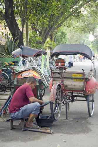 becak puncture-AsiaPhotoStock