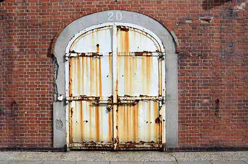 red brick warehouse door-AsiaPhotoStock