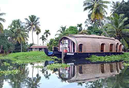 reflected boat kerala-AsiaPhotoStock