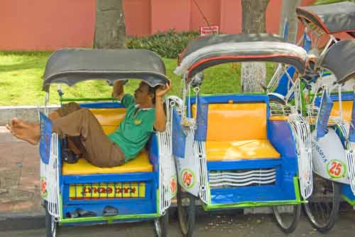 resting becak driver-AsiaPhotoStock