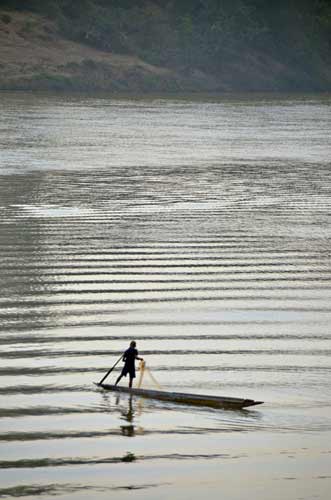 ripples and fisherman-AsiaPhotoStock