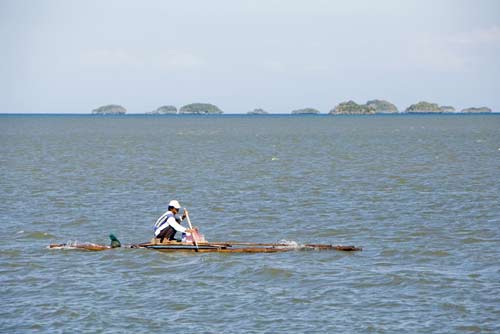 rowing bamboo raft-AsiaPhotoStock