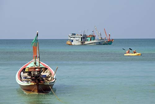 rowers by fishing boats-AsiaPhotoStock