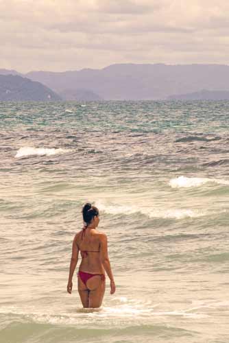 sea with model in red-AsiaPhotoStock