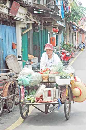 seller on bike-AsiaPhotoStock