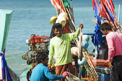 fisherman with shark-AsiaPhotoStock