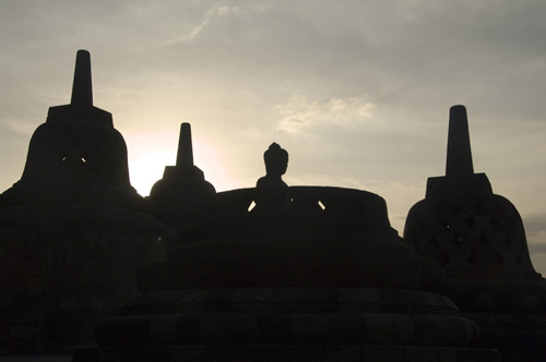 silhouetted buddha-AsiaPhotoStock