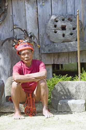 ifugao sits by his house-AsiaPhotoStock
