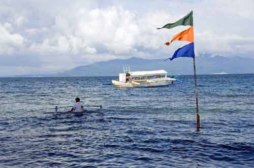 small boat and flags-AsiaPhotoStock