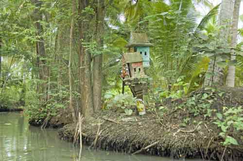 spirit houses on khlong-AsiaPhotoStock