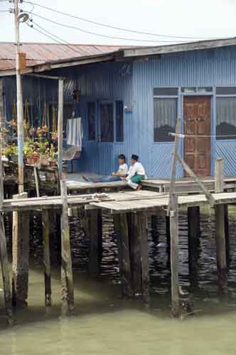 stilt house and boys-AsiaPhotoStock