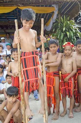 a young boy on stilts-AsiaPhotoStock