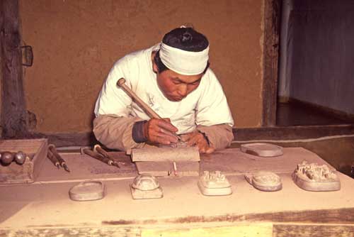 stone carver-AsiaPhotoStock