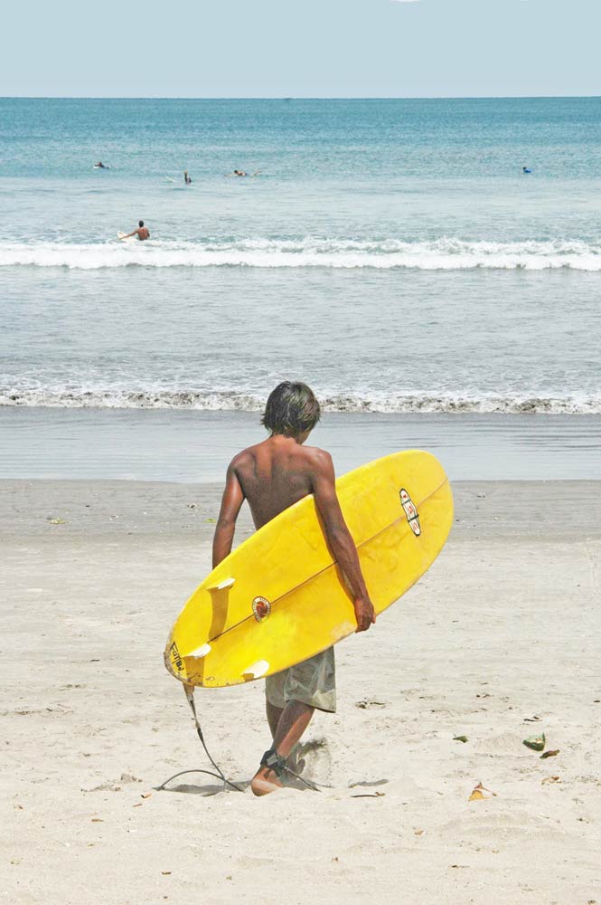 surfer carrying board-AsiaPhotoStock