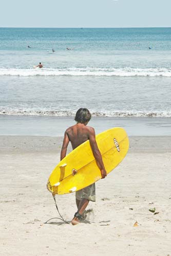 surfer carrying board-AsiaPhotoStock