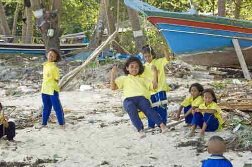 girl on a swing at beach-AsiaPhotoStock