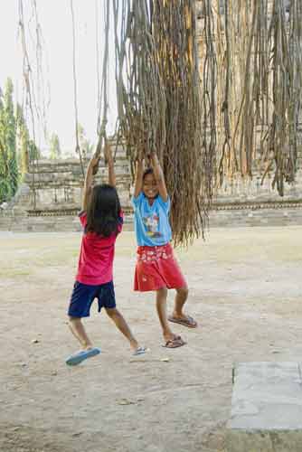 swinging on tree-AsiaPhotoStock