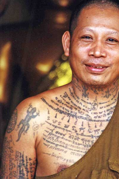 tattooed thai monk-AsiaPhotoStock
