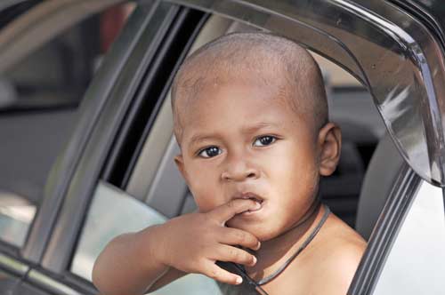 thai boy in car-AsiaPhotoStock