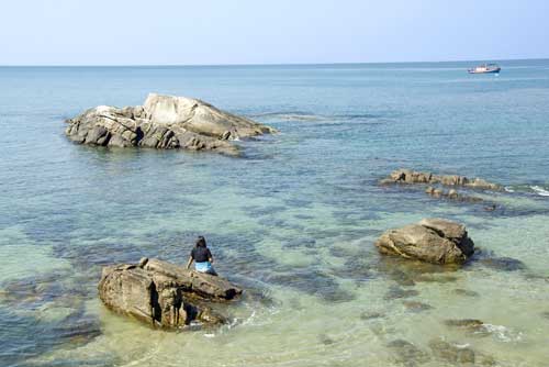 thinking on a rock-AsiaPhotoStock