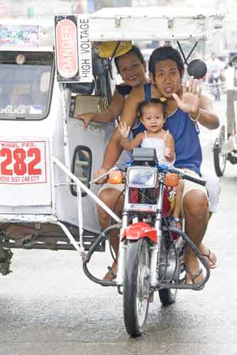 family in tricycle-AsiaPhotoStock
