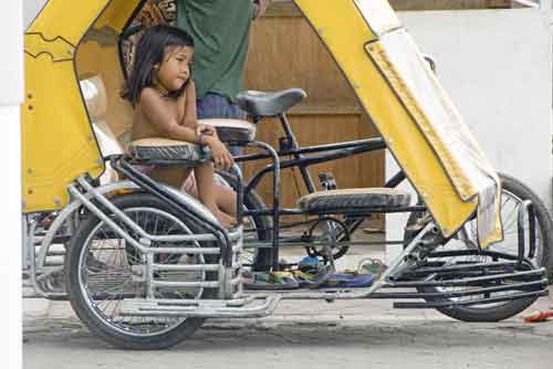 girl on a tricycle-AsiaPhotoStock