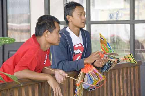 plastic bird sellers-AsiaPhotoStock