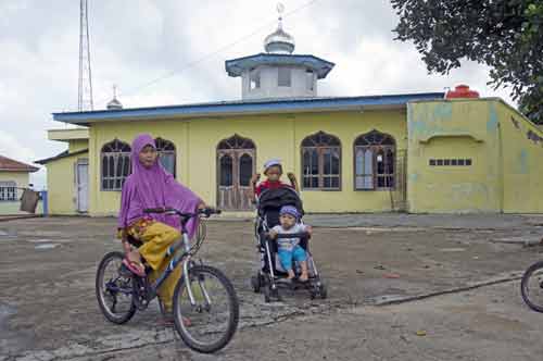 villagers near mosque-AsiaPhotoStock