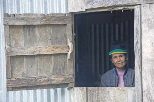 lady in window-AsiaPhotoStock