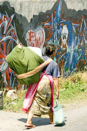 woman by wall-AsiaPhotoStock