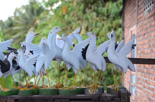 wooden birds carvings-AsiaPhotoStock