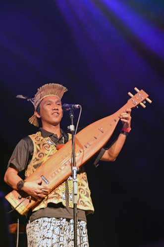 young sape player-AsiaPhotoStock